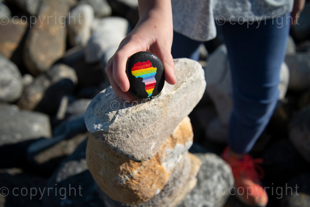 Rock artist Lara Thompson's daugther Shae, 12, demonstrates how they hide her mother's rocks for people to find near Slangkop light house in Kommetjie, Cape Town, Thursday, July 17, 2020. PHOTO: EVA-LOTTA JANSSON 