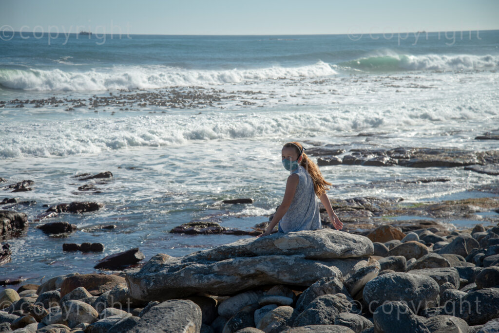 Rock artist Lara Thompson's daugther Shae, 12, enjoys the ocean view near Slangkop light house in Kommetjie, Cape Town, Thursday, July 17, 2020. As she often has seasonal allergies and other respiratory problems, she hasn't been back to school since lockdown started, her mother says. PHOTO: EVA-LOTTA JANSSON 