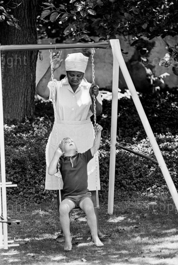 Mrs Regina Molokoane playing with Ian. A happy family nearly broken up by death. Mrs Regina Molokoane the first and maybe only African kidney transplant, is enjoying life to the full. When her husband died she decided to get a job with Mrs Marcelle Norman in Parktown. Mrs Norman and her son Ian was like a family to her, after the transplant Mrs Norman took Regina to her home to take care of her.
