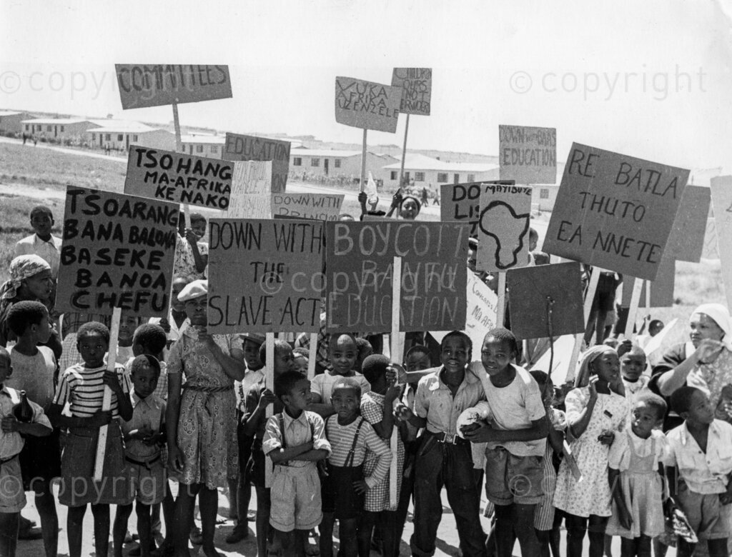 The Shut-down On African Education – A black cloud is sweeping over African Education today. There is a pincer movement closing in on centres of learning. In primary schools that unfortunate Bantu Education Act has arrived! Masses of parents, under the banner of the African National Congress, particularly on the Reef, went on boycott from the fatal day of April 1 by withdrawing their children from the schools. And the Government reply? Numbers of children who did not turn up for school by and on April 25 have been banned from schooling anywhere in the union. As a result, of total number of 6,948 pupils coming under this ban, 116 teachers in all have been served with a month's notice to leave school.
