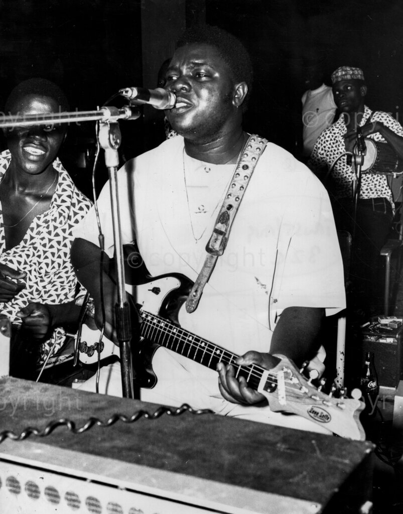Nigerian youth performing music.