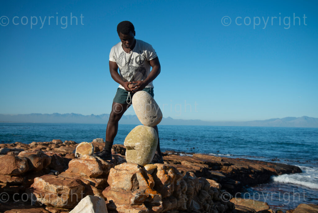 Sipho Njengezi balances rocks in Kalk Bay, Cape Town, on Thursday afternoon, July 17, 2020. PHOTO: EVA-LOTTA JANSSON 