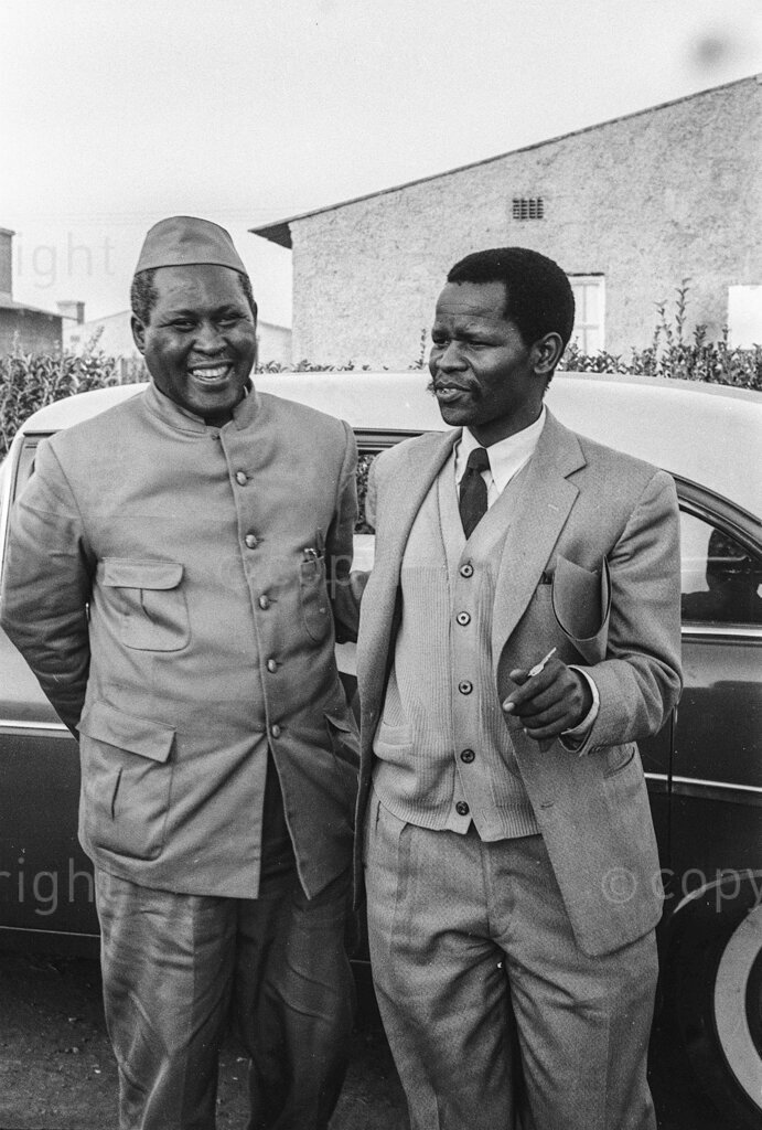 Banned Chief Luthuli, shut on his farm, says that there's Freedom In The Air – Chief Luthuli and Oliver Tambo at Johannesburg Station, before his banning in May 1959. There were more policemen waiting for him at Germiston, where Luthuli climbed out to greet his friend Oliver Tambo. They followed him to Tambo's house, where Luthuli slept. Next day was Saturday, the day for Luthuli to come to Johannesburg. More police at Germiston station. More police and a thousand people waiting on the platform at Johannesburg. These people were not there as an organised greeting. They had come by chance in case Luthuli arrived.