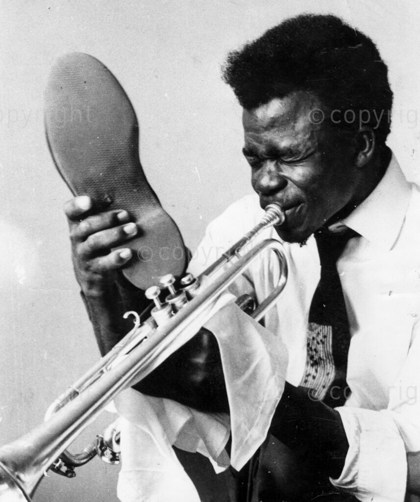 Nigeria's Hi-De-Jazzman; Zeal Onyia. His long fingers over-worked, his lithe feet take a turn. When he plays the silvery, talking, trumpet, the folks flock to him like the rats of Hamelin flocked to the Pied Piper. He's the boy who nurses the ambition to Satchmo like Louis Armstrong in jazz trumpeting. Zeal Onyia started playing the flute at the age of four, played the drums at the age of eight, blew the trombone at the age of eleven, and the trumpet at the age of fifteen.