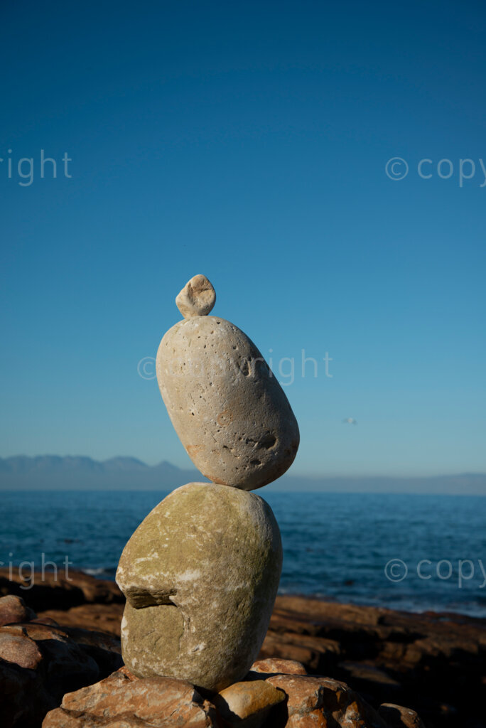 Sipho Njengezi balances rocks in Kalk Bay, Cape Town, on Thursday afternoon, July 17, 2020. PHOTO: EVA-LOTTA JANSSON 