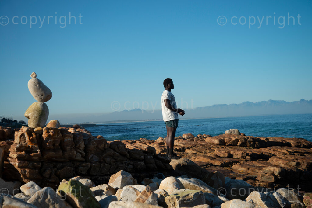 Sipho Njengezi balances rocks in Kalk Bay, Cape Town, on Thursday afternoon, July 17, 2020. PHOTO: EVA-LOTTA JANSSON 