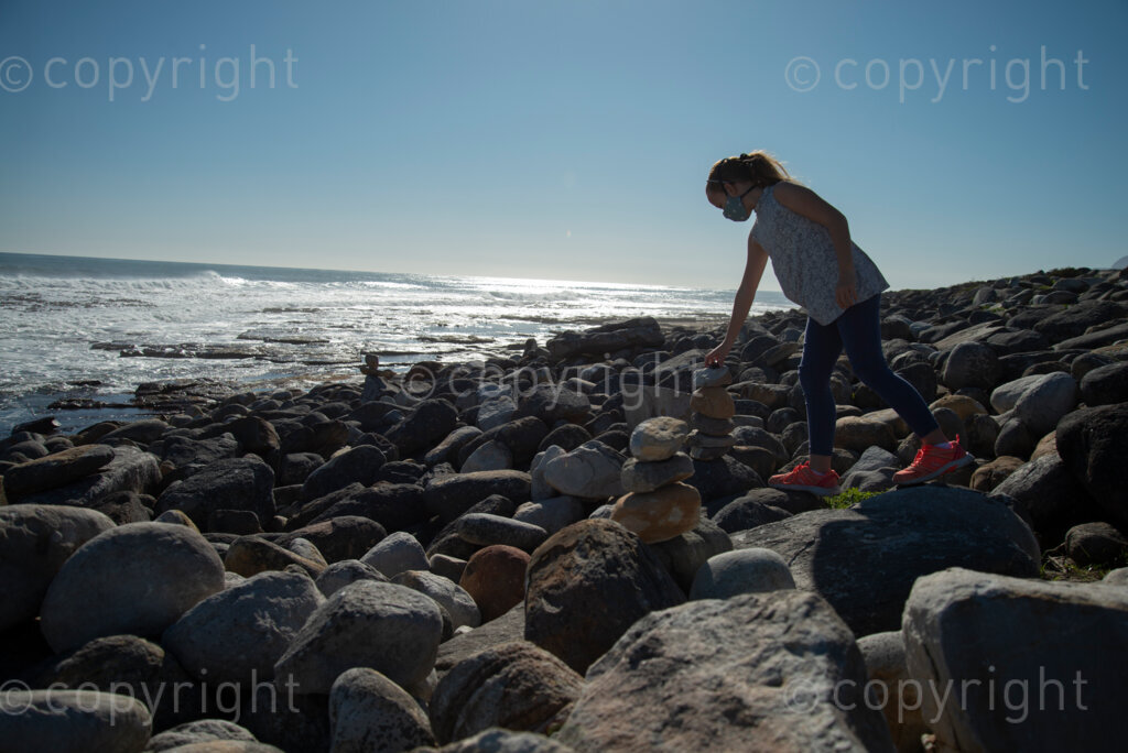 Rock artist Lara Thompson's daugther Shae, 12, demonstrates how they hide her mother's rocks for people to find near Slangkop light house in Kommetjie, Cape Town, Thursday, July 17, 2020. PHOTO: EVA-LOTTA JANSSON 
